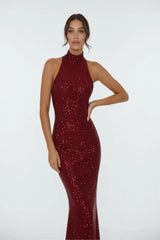 Close-up of elegant red sequin evening gown with high neck and fitted silhouette for women