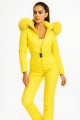 Women's yellow quilted jumpsuit with fur hood and gold belt – vibrant luxury winter outfit
